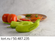 Selective focus green chili and blure background whit canned sardine with tomato sauce and cooking ingredient was beautiful arrangement in wooden tray, copy space. Стоковое фото, агентство Ingram Publishing / Фотобанк Лори