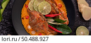 Tom yum crab with lemon, chili, tomato, garlic, lemongrass, kaffir lime leaves in a plate. Стоковое фото, агентство Ingram Publishing / Фотобанк Лори