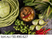 Chicken and meatball sauce with eggplant, chili, long beans, cabbage, and eggplant. Стоковое фото, агентство Ingram Publishing / Фотобанк Лори
