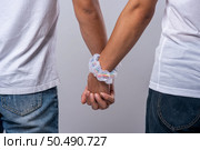 Two men who love each other stand hand in hand. Стоковое фото, агентство Ingram Publishing / Фотобанк Лори