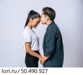 Women couples stand and fragrant cheek. Стоковое фото, агентство Ingram Publishing / Фотобанк Лори