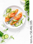 Sandwiches with salted salmon. Healthy food, breakfast. Top view. Стоковое фото, агентство Ingram Publishing / Фотобанк Лори