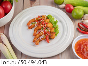 Shrimp deep-fried batter arranged beautifully in a white dish. Стоковое фото, агентство Ingram Publishing / Фотобанк Лори