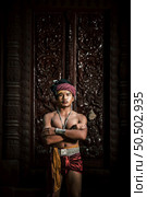 Portrait Handsome shirtless man in turban on head and beautiful silver ornament, The actor in Perform on legend love popular story, Thai Isan folktale called "Phadaeng and Nang-ai" in acient site. Стоковое фото, агентство Ingram Publishing / Фотобанк Лори