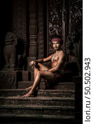Portrait Handsome shirtless man in turban on head and beautiful silver ornament, The actor in Perform on legend love popular story, Thai Isan folktale called "Phadaeng and Nang-ai" in acient site. Стоковое фото, агентство Ingram Publishing / Фотобанк Лори