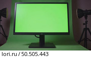 Professional 21 9 monitor for color grading, photo retouching or graphic motion design. Green chroma key screen set up. Spinning director chair for movie editin. Стоковое AI-видео, аниматор Sergey Grishin / Фотобанк Лори