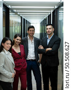 portrait of New business group person in the corridor of the conference room, Rehearse information to present results and new projects to the management team for consideration. Стоковое фото, агентство Ingram Publishing / Фотобанк Лори