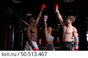 Foreigners who start learning Thai boxing went up on stage and lost. Friends encourage and help practice to win next time. Стоковое фото, агентство Ingram Publishing / Фотобанк Лори