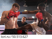 Using the feet is one of the master techniques of Muay Thai that is used to kick and lift to prevent kicks. which boxers are popularly used as weapons, Muay Thai,Thai martial arts. Стоковое фото, агентство Ingram Publishing / Фотобанк Лори