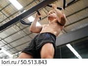 Mixed martial arts fighter going to the gym to build strong muscles To help make the collision more intense and help reduce injuries from punching as well. Стоковое фото, агентство Ingram Publishing / Фотобанк Лори