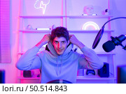 Professional gamer is a gamer for prize money or to overcome obstacles Usually, gamers study games deeply in order to master them and often play them competitively. Стоковое фото, агентство Ingram Publishing / Фотобанк Лори
