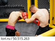 Muay Thai, The martial art of Thailand, The power of the fist that punches into the opponent’s be colic, choke and can lose by knockout. Стоковое фото, агентство Ingram Publishing / Фотобанк Лори