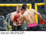 Muay Thai, The martial art of Thailand, The power of the fist that punches into the opponent’s be colic, choke and can lose by knockout. Стоковое фото, агентство Ingram Publishing / Фотобанк Лори