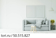 The living room is decorated with chairs, sofaand picture frames. Стоковое фото, агентство Ingram Publishing / Фотобанк Лори