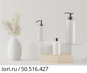 Pump bottle for cream or perfume on white background. Стоковое фото, агентство Ingram Publishing / Фотобанк Лори