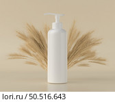 Pump bottle for cream or perfume on gray background. Стоковое фото, агентство Ingram Publishing / Фотобанк Лори