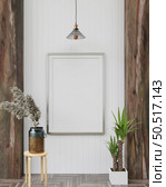 Picture frames with plant pots adorn the living room. Стоковое фото, агентство Ingram Publishing / Фотобанк Лори