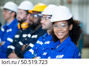 Group of emotional engineers who take pleasure in the achievement of the responsible project’s work. Стоковое фото, агентство Ingram Publishing / Фотобанк Лори