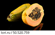 Fresh and tasty papaya on black background. Стоковое фото, агентство Ingram Publishing / Фотобанк Лори