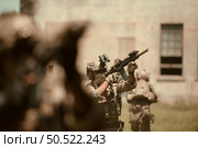 Professional marine soldiers training with weapon on a military range. Стоковое фото, агентство Ingram Publishing / Фотобанк Лори