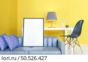 The living room is decorated with sofa and picture frames, 3D style. Стоковое фото, агентство Ingram Publishing / Фотобанк Лори