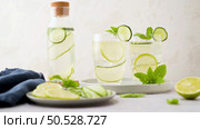 Water flavored with lemon, cucumber and lemongrass leaves. Стоковое фото, агентство Ingram Publishing / Фотобанк Лори