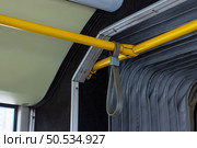 A yellow railing that has a strap securely attached to it. Стоковое фото, фотограф Аксенова Вера / Фотобанк Лори