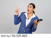 Portrait Asian young woman in officer uniform standing with mobile phone in hand posture, Cheerful girl with happy smiling during use smartphone, isolated on white background. Стоковое фото, агентство Ingram Publishing / Фотобанк Лори