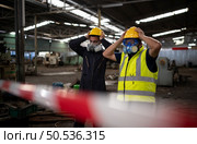 The headache of scientists and government officials. who went to inspect and collect samples of chemical leaks in industrial sites. Стоковое фото, агентство Ingram Publishing / Фотобанк Лори