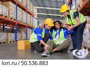 Working in a large industrial facility with heavy materials and machinery. Safety considerations are therefore of the utmost significance. Extreme vigilance must be exercised in this situation. Стоковое фото, агентство Ingram Publishing / Фотобанк Лори