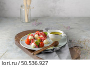 Italian style appetizer, antipasto skewer or caprese on a stick with basil, salami, mozarella and tomatoes. Стоковое фото, агентство Ingram Publishing / Фотобанк Лори