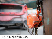 The car crashed so hard that the car body collapsed into distortion. A car body puller is required to restore the car body to its original shape. Стоковое фото, агентство Ingram Publishing / Фотобанк Лори
