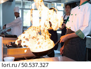 Chefs that specialize in cooking will be meticulous with every cooking process. Even minor details will not be overlooked. As with stir-fry, high heat will be used until a flaming flame appears. Стоковое фото, агентство Ingram Publishing / Фотобанк Лори