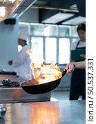 Chefs that specialize in cooking will be meticulous with every cooking process. Even minor details will not be overlooked. As with stir-fry, high heat will be used until a flaming flame appears. Стоковое фото, агентство Ingram Publishing / Фотобанк Лори