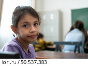 A group of students from an international school that promotes creativity and places children at the center of learning in a variety of subjects. Стоковое фото, агентство Ingram Publishing / Фотобанк Лори
