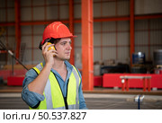 Chief mechanical engineer working in a mechanical factory Controlling machine testing in the factory. Стоковое фото, агентство Ingram Publishing / Фотобанк Лори