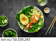 Salmon avocado bowl with broccoli, green peas, rice and fresh salad. Healthy food, top view. Стоковое фото, агентство Ingram Publishing / Фотобанк Лори
