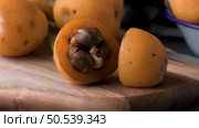 loquats on kitchen counter background. Стоковое фото, агентство Ingram Publishing / Фотобанк Лори