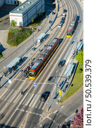 Electric trams driving in the streets of Warsaw. Electric trams in Warsaw. Стоковое фото, агентство Ingram Publishing / Фотобанк Лори