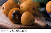 loquats on kitchen counter background. Стоковое фото, агентство Ingram Publishing / Фотобанк Лори