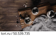 Chia pudding with blackberries, three portions in glass jars on a dark table. Стоковое фото, агентство Ingram Publishing / Фотобанк Лори