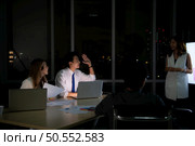 Group of broker international stock traders working actively at night in office, Everyone is striving for the team’s success. Стоковое фото, агентство Ingram Publishing / Фотобанк Лори