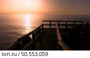 Sunset view from the wooden walkway on Carrapateira, District Aljezur, Algarve Portugal. Стоковое фото, агентство Ingram Publishing / Фотобанк Лори