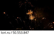 Multiple fireworks explosions on a dark night sky. Стоковое фото, агентство Ingram Publishing / Фотобанк Лори