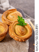 Pastries filled with meat, traditionally baked in black clay molds both from the region on Vila Real, Portugal. Стоковое фото, агентство Ingram Publishing / Фотобанк Лори