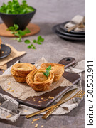 Pastries filled with meat, traditionally baked in black clay molds both from the region on Vila Real, Portugal. Стоковое фото, агентство Ingram Publishing / Фотобанк Лори
