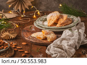 A crescent-shaped pastry whose filling is made of eggs and almonds wrapped in crispy dough, cut in an artisanal way and sprinkled with sugar. Стоковое фото, агентство Ingram Publishing / Фотобанк Лори