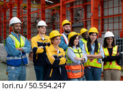 Portrait of engineers and industrial workers in hardhats at construction site. Стоковое фото, агентство Ingram Publishing / Фотобанк Лори