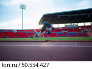 Athletes with disabilities take a break at the stadium between training sessions. Стоковое фото, агентство Ingram Publishing / Фотобанк Лори