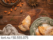 A crescent-shaped pastry whose filling is made of eggs and almonds wrapped in crispy dough, cut in an artisanal way and sprinkled with sugar. Стоковое фото, агентство Ingram Publishing / Фотобанк Лори